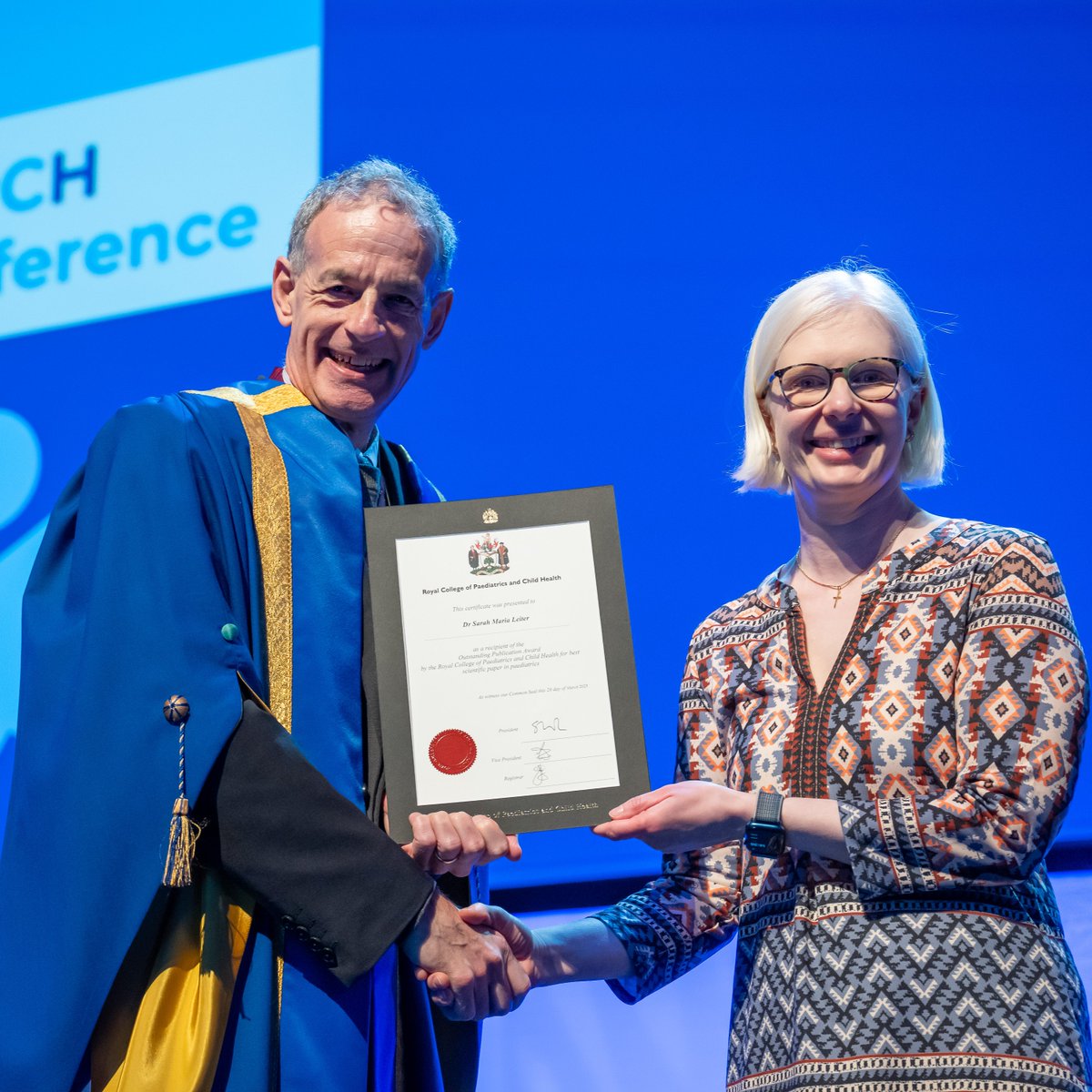 Image of Dr Sarah Leiter, clinical fellow in the Behjati lab, being awarded the RCPCH Outstanding Publication Award.