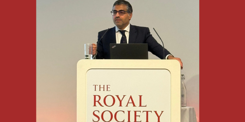 Professor Sam Behjati speaking at a podium inscribed with The Royal Society logo. Sam was giving the Francis Crick Medal Lecture in London in 2025.